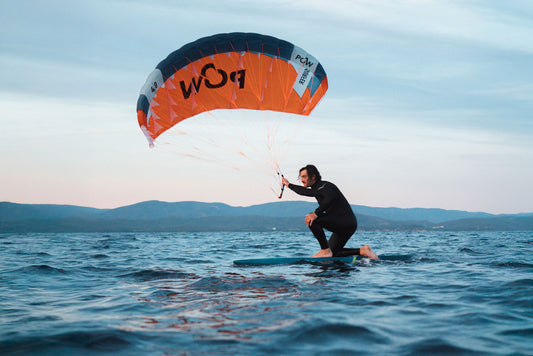 Flysurfer POW Parawing in action, showcasing its design and lightweight construction against a clear sky.